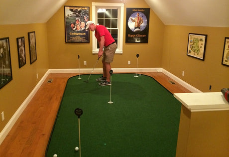 man playing on indoor putting green