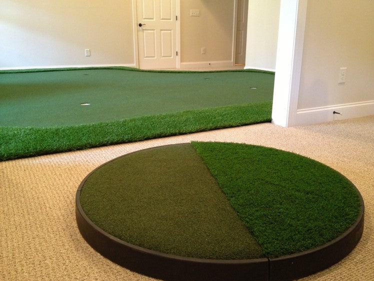 chipping pad next to custom golf green in golf room
