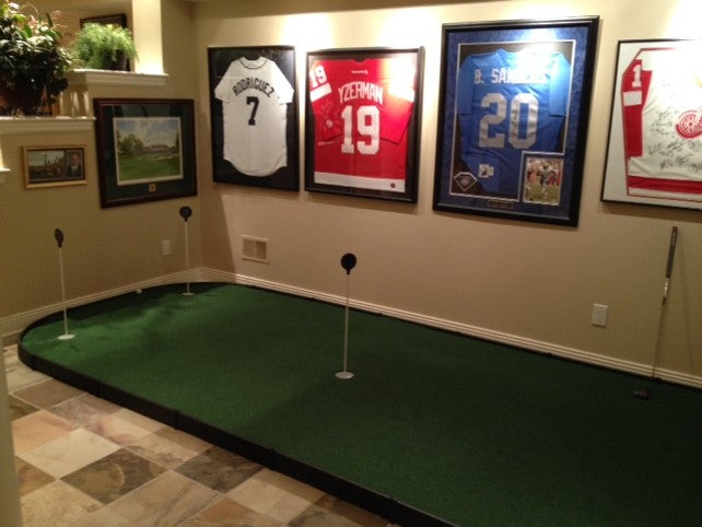 large indoor putting green in golf room